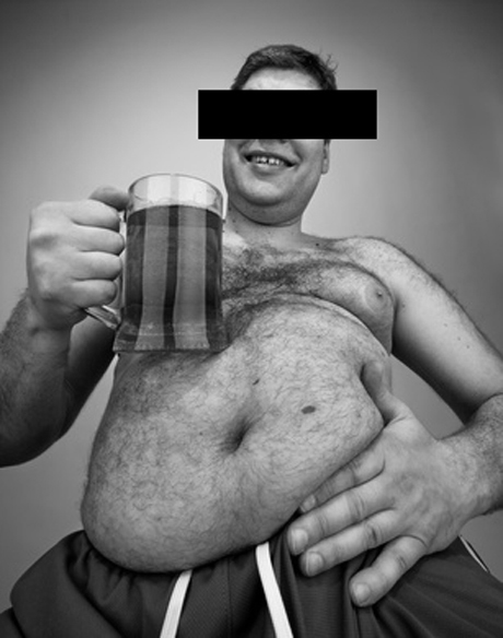 Funny fat man with glass of beer